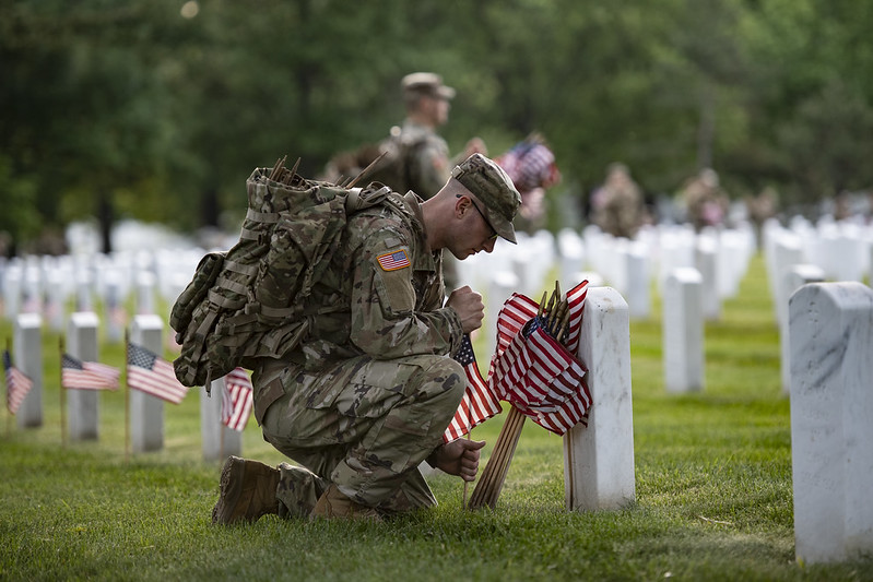 Service member honors the fallen at graveside in Arlington National cemetery